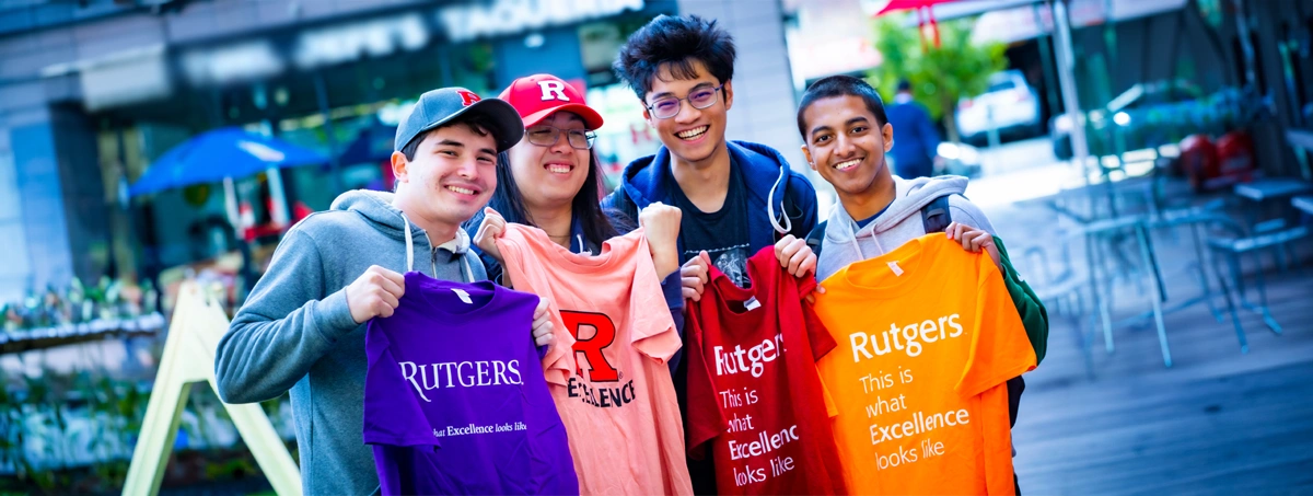 ( L to R) Ethan Bompane (SAS '24), Corey Chow (MGSA '23), Enver Aman (SAS '24), and Dewan Chowdhury (SAS '24) show off Rutgers Excellence t-shirts