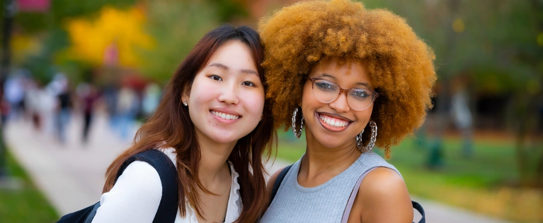 Diane Kim (SAS '25) and Ryan Davis (SAS '25) pose for a photo on Livingston campus